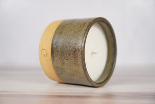Autumn Green dark green glaze candle on light brown speckled ceramic vessel, second view