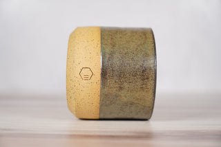 Autumn Green dark green glaze candle on light brown speckled ceramic vessel, third view