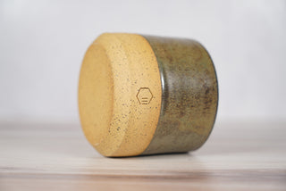 Autumn Green dark green glaze candle on light brown speckled ceramic vessel, fourth view