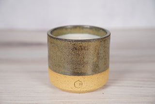 Autumn Green dark green glaze candle on light brown speckled ceramic vessel, viewed from above