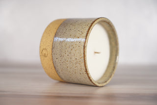 Birch pattern candle on light brown speckled ceramic vessel, second view