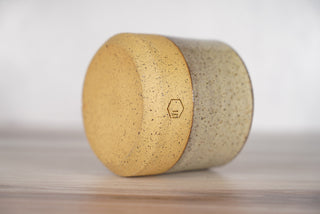 Birch pattern candle on light brown speckled ceramic vessel, fourth view