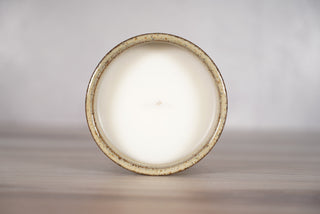 Birch pattern candle on light brown speckled ceramic vessel, fifth view