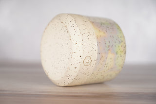 Mother of pearl glaze on white speckled ceramic candle vessel, fourth view