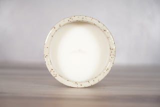 Mother of pearl glaze on white speckled ceramic candle vessel, fifth view