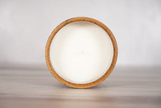 Spiderweb pattern candle on light brown speckled ceramic vessel, fifth view