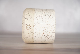 White glaze on white speckled ceramic candle vessel, third view